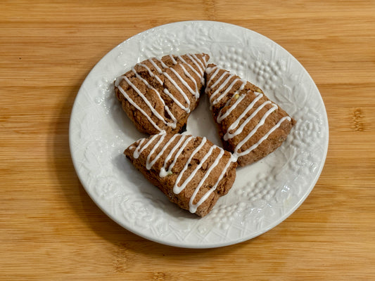 three mini peppermint mocha scones with mint icing on a decorative plate