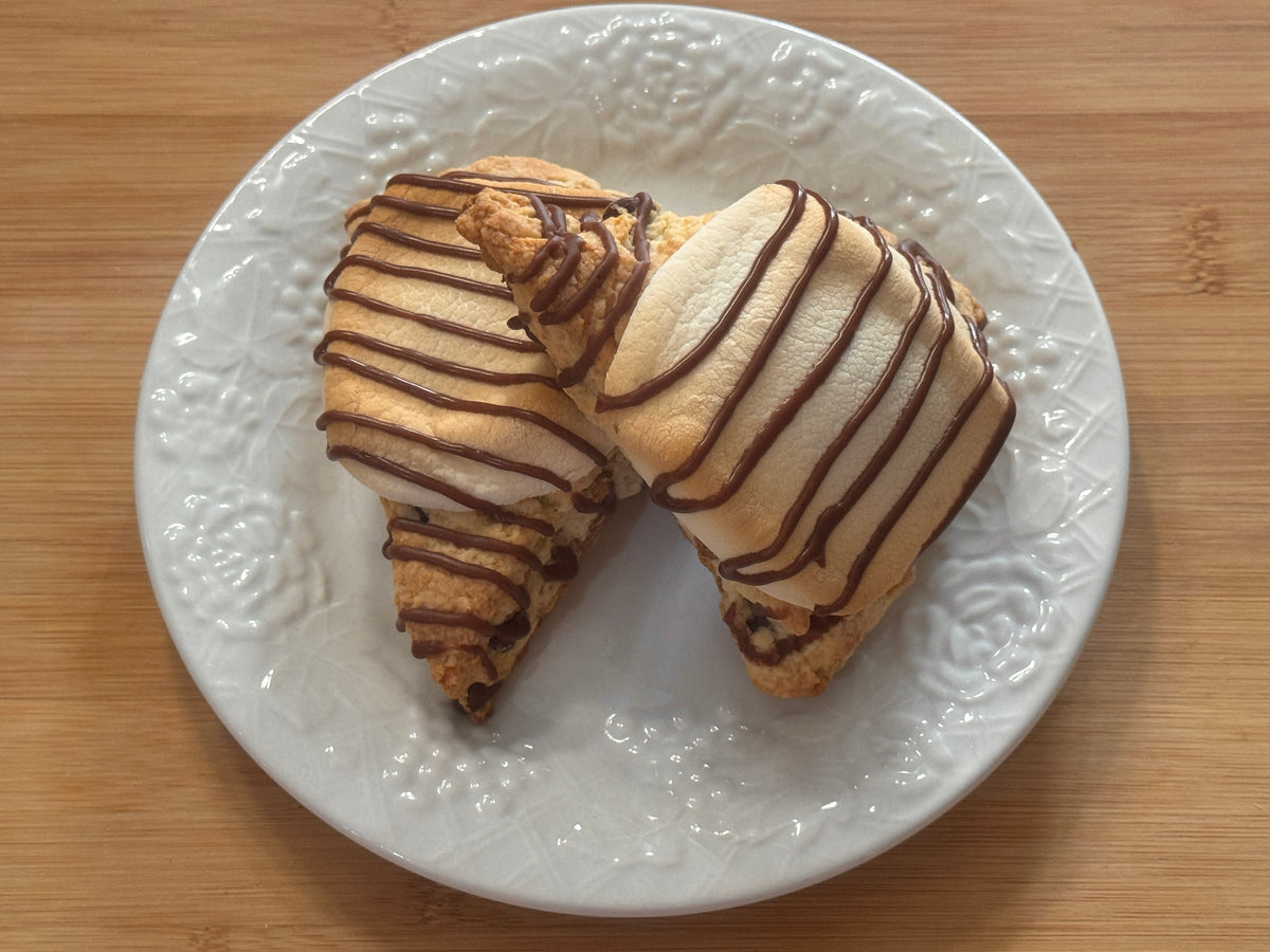 two regular sized s'mores scones on a white plate