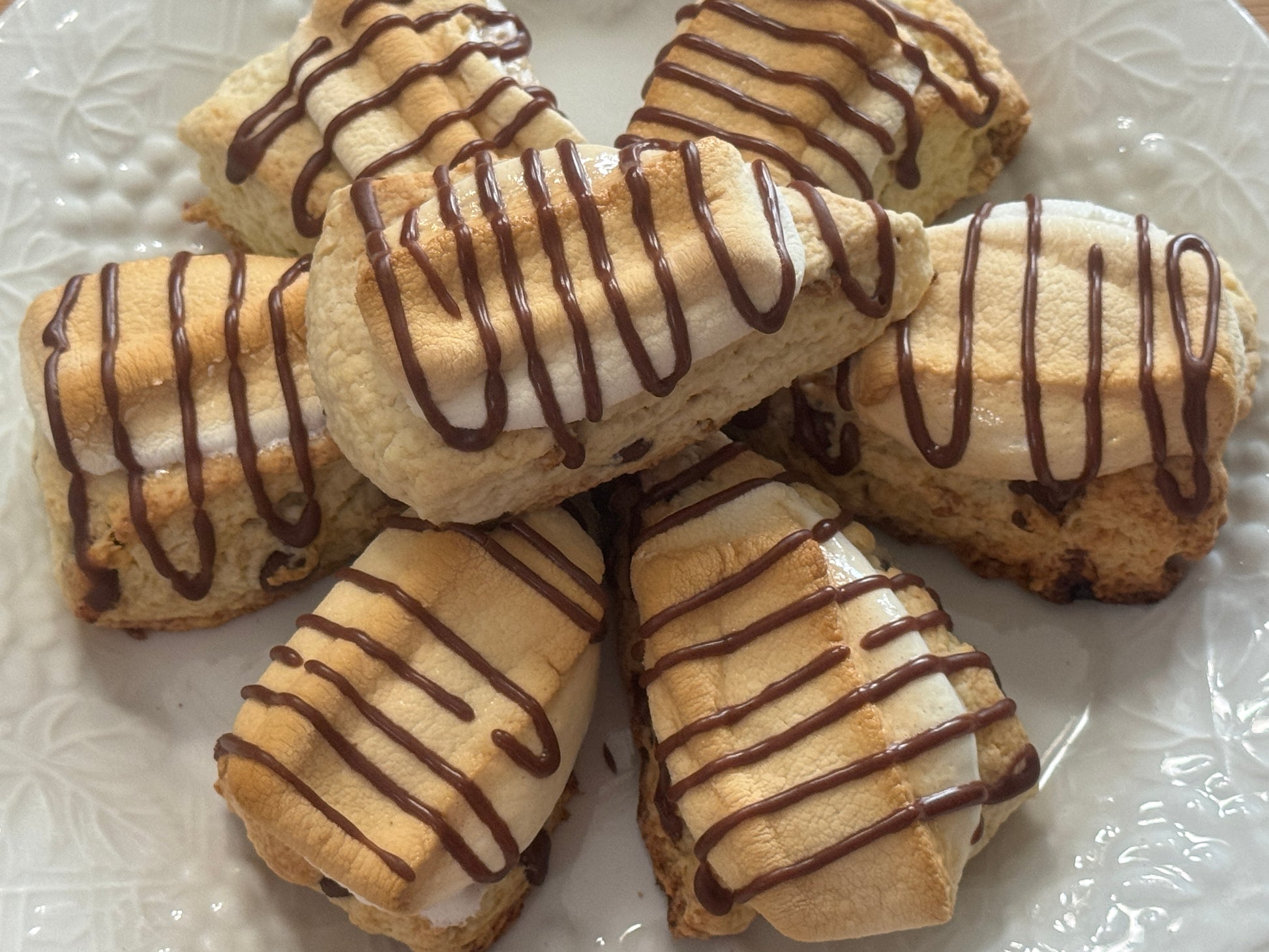 a close up look at the plate full of s'mores mini scones