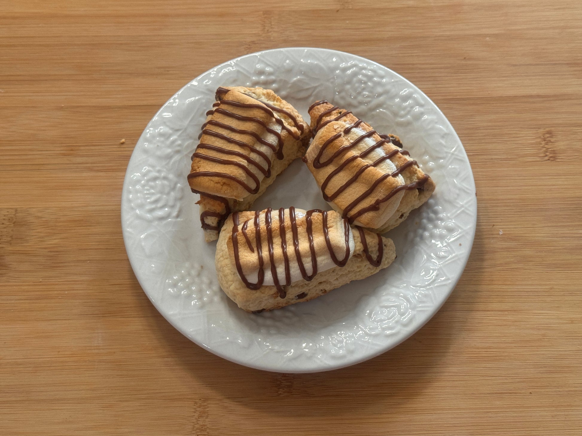three mini s'mores scones on a white plate